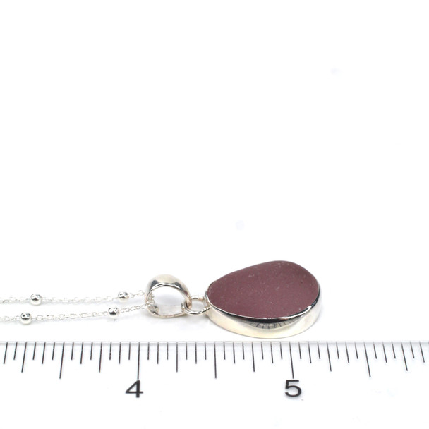Lavender Ice Sea Glass Single Bezel Necklace on ruler for size reference.