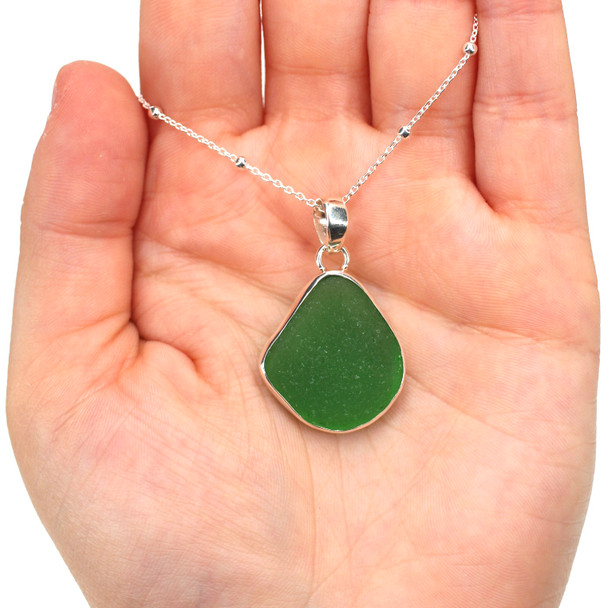Green Sea Glass Single Bezel Necklace on model for color reference.
