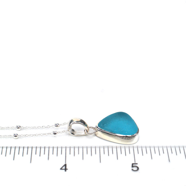 Turquoise Sea Glass Single Bezel Necklace on ruler for size reference.