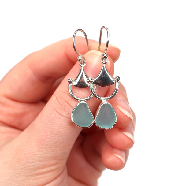 Aqua Sea Glass Bit Earrings on model for color reference.