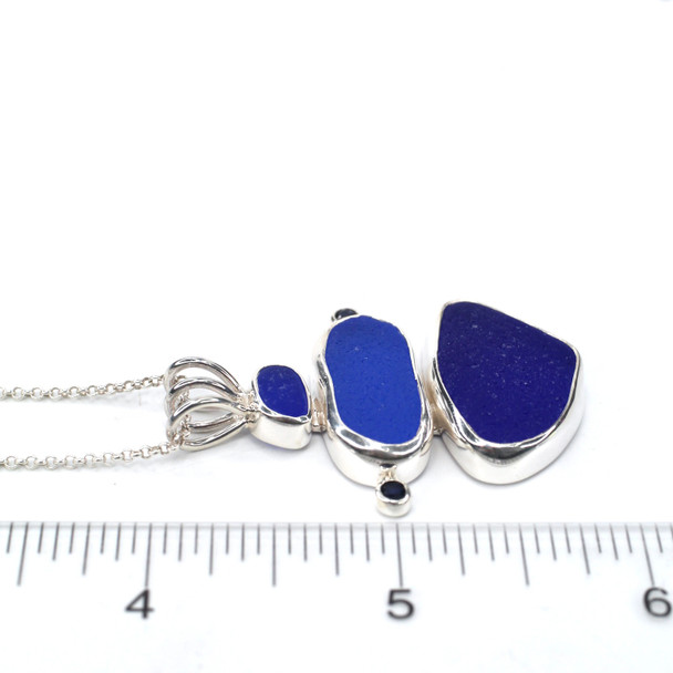 Cobalt and Cornflower Sea Glass and Sapphire Tidal Trio Necklace on ruler for size reference.