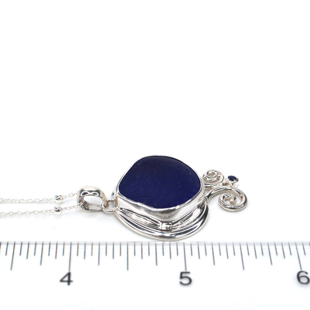 Cobalt Sea Glass and Sapphire Ocean Curl Necklace on ruler for size reference.