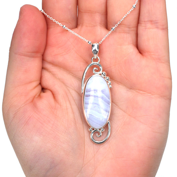 Lace Agate Whirling Wave Necklace on model for color reference.