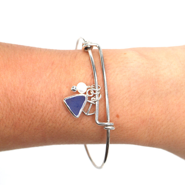 Cornflower Triangle Sea Glass Adjustable Anchor Charm Bangle Bracelet on model for color reference.