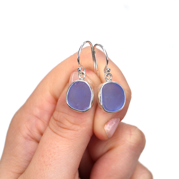 Cornflower Sea Glass Single Bezel Earrings on model for color reference.