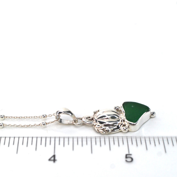Green Forest Sea Glass Double Pumpkin Necklace on ruler for size reference.