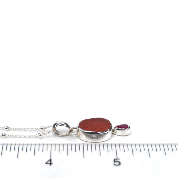 Pink Sea Glass and Ruby Double Necklace on ruler for size reference.