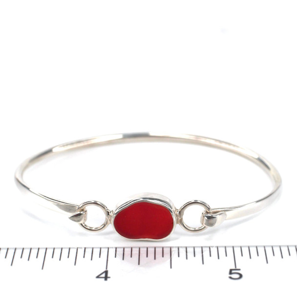 Red Bright Sea Glass Bezel Bangle Bracelet on ruler for size reference.