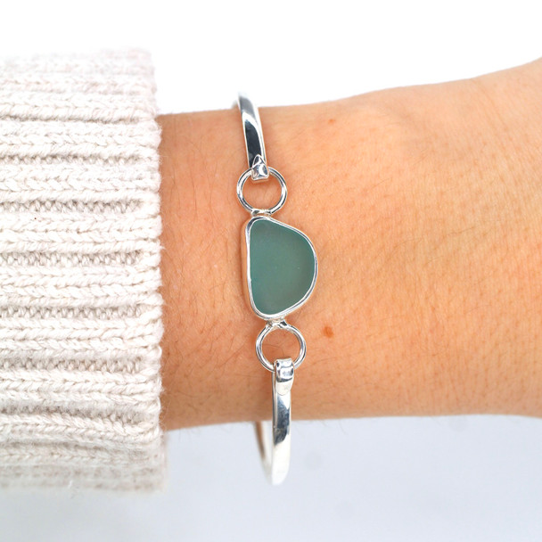 Aqua Gumdrop Sea Glass Bezel Bangle Bracelet on model for color reference.