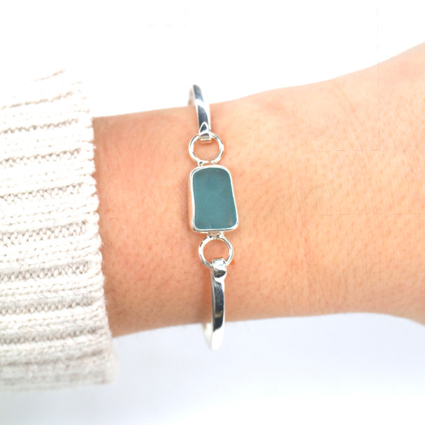 Aqua Rectangle Sea Glass Bezel Bangle Bracelet on model for color reference.