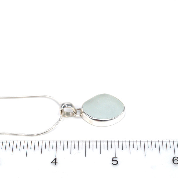 White Sea Glass Single Bezel Necklace on ruler for size reference. 