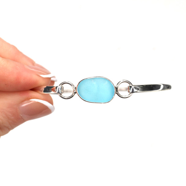 Turquoise Oval Sea Glass Hinge Bangle Bracelet held