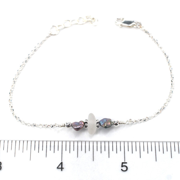 Winter White Crisp Sea Glass and Dainty Peacock Pearl Bracelet on ruler for size reference.