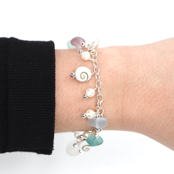 Lavender Icy Blues Sea Glass and Shiva Shell Charm Bracelet on model for color reference.