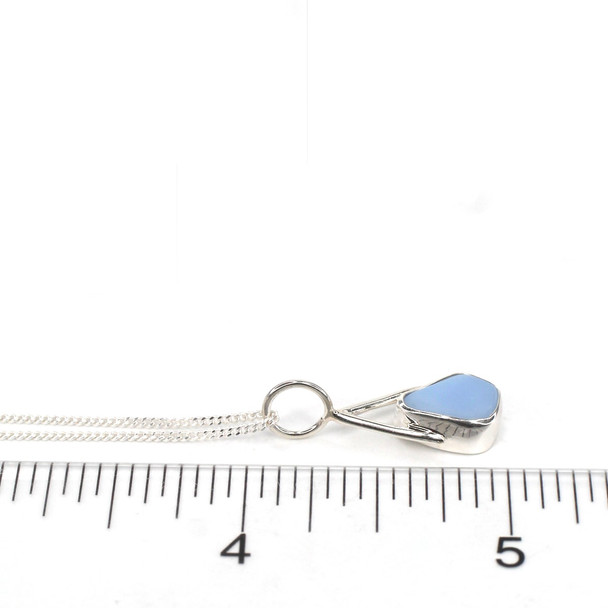 Cornflower Milk Glass Lunar Drop Charm on ruler for size reference. 