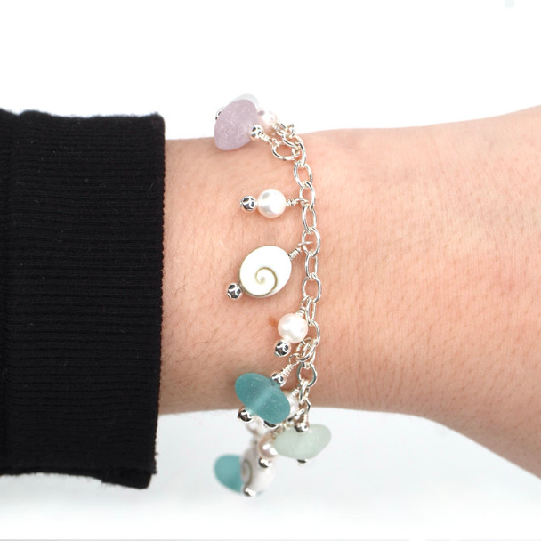 Perfectly Pastel Sea Glass and Shiva Shell Charm Bracelet on model for color reference.