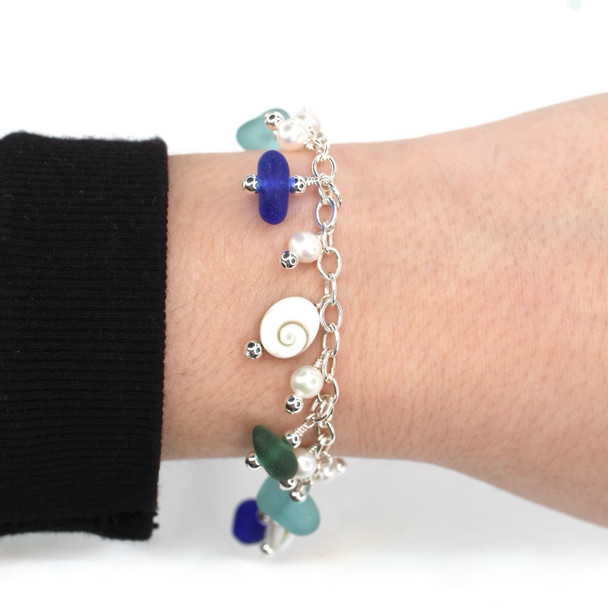 Olive Tropical Sea Glass and Shiva Shell Charm Bracelet on model for color reference.