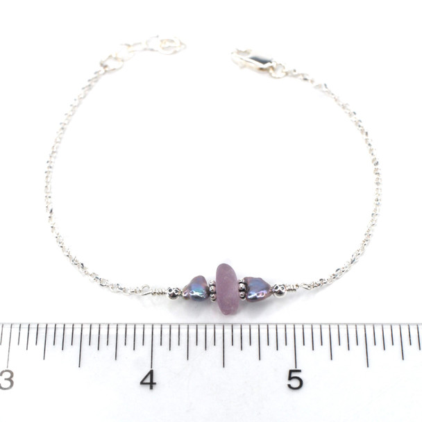 Purple Bright Sea Glass and Dainty Peacock Pearl Bracelet on ruler for size reference.