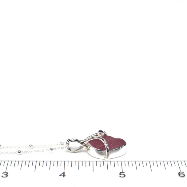 Purple Sea Glass and Amethyst Drop Necklace on ruler for size reference.