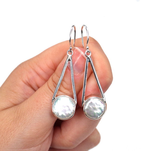 Pearl Lunar Drop Earring  on model for color reference.