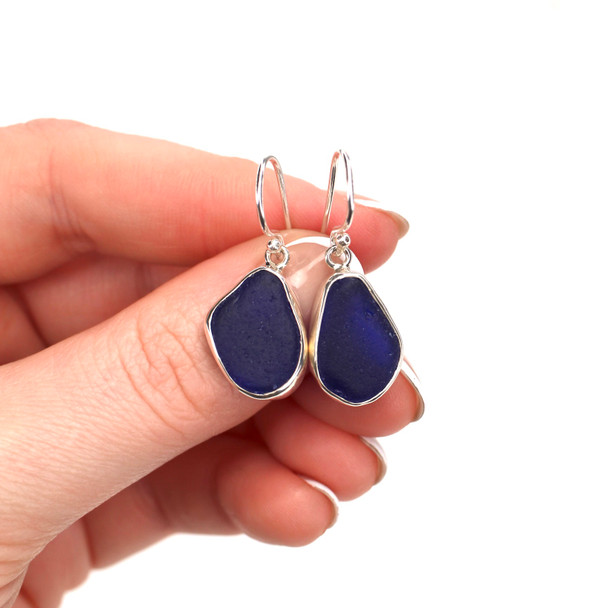 Cobalt Droplet Sea Glass Bezel Earrings on model for color reference. 