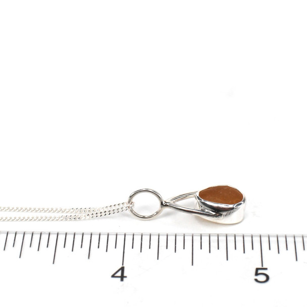 Amber Golden Sea Glass Lunar Drop Charm on ruler for size reference. 