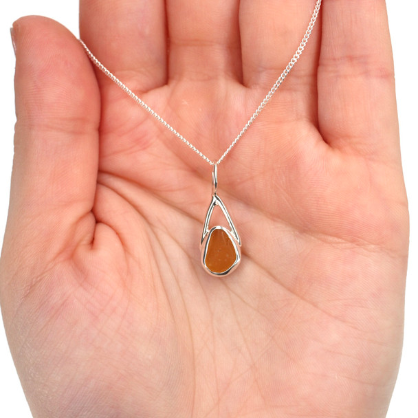 Amber Golden Sea Glass Lunar Drop Charm on model for color reference. 