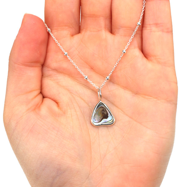 Abalone Ripple Charm on model for color reference.
