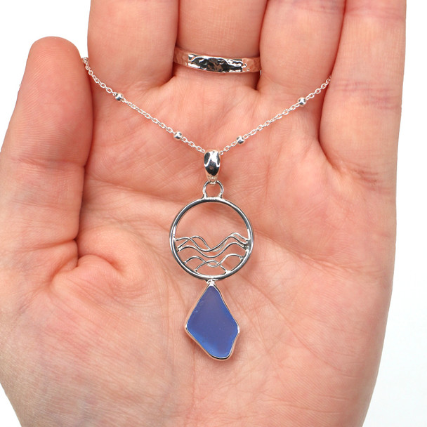 Cornflower Sea Glass Ocean Wave Necklace on model for color reference.