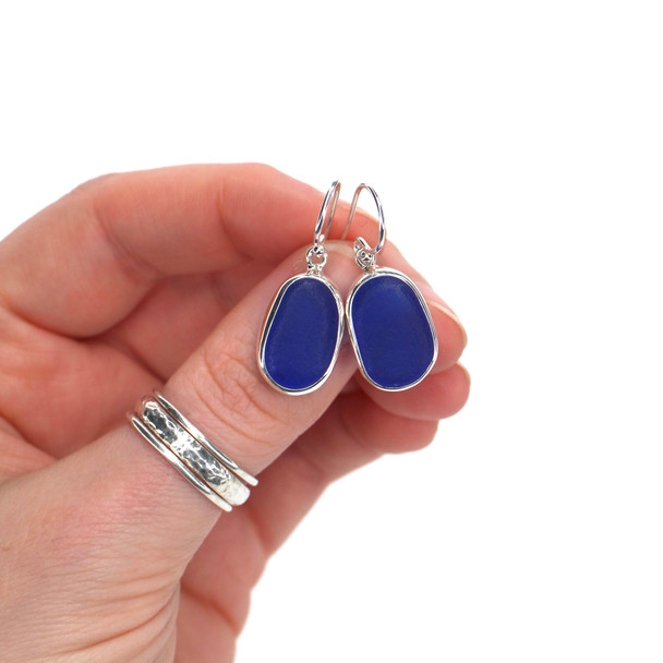 Cobalt Oval Sea Glass Bezel Earrings on model for color reference. 