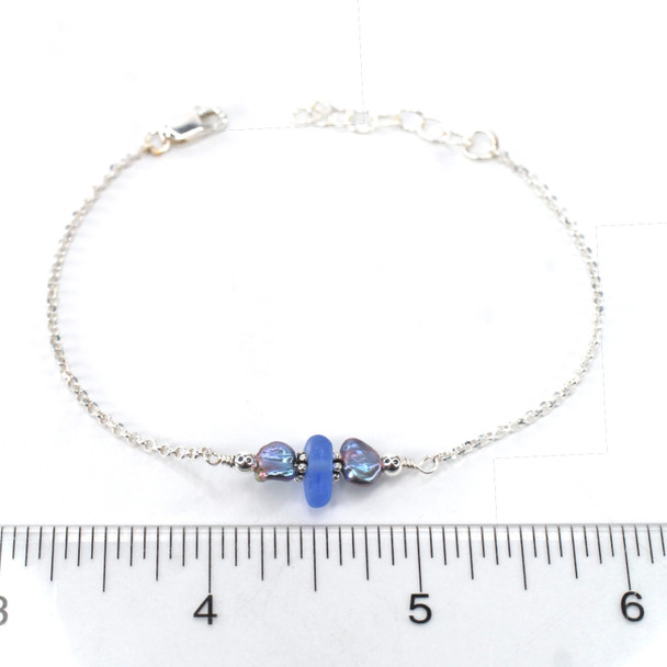 Cornflower Smooth Sea Glass and Dainty Peacock Pearl Bracelet on ruler for size reference.