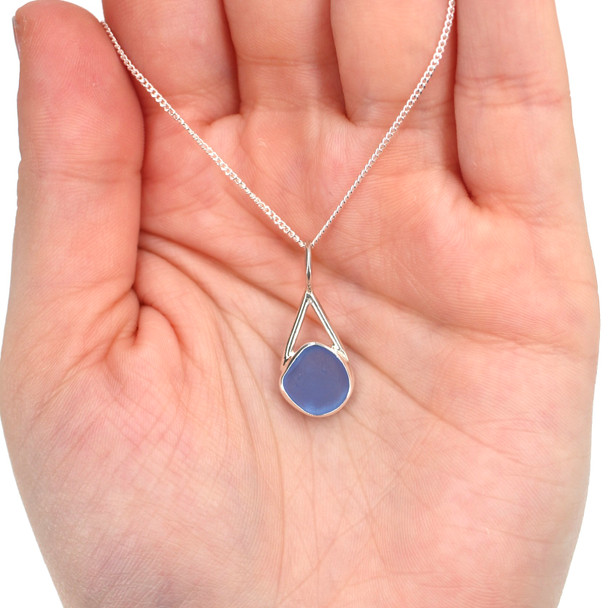 Cornflower Rounded Sea Glass Lunar Drop Charm on model for color reference. 