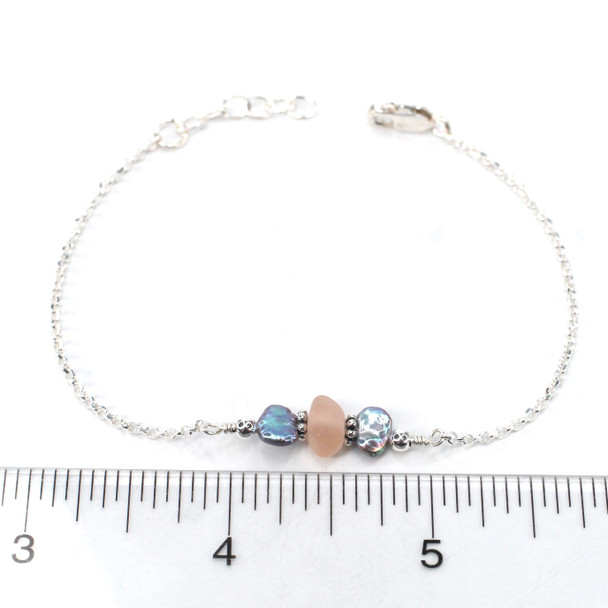 Pink Sea Glass and Dainty Peacock Pearl Bracelet on ruler for size reference.