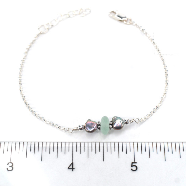 Seafoam Sea Glass and Dainty Peacock Pearl Bracelet on ruler for size reference.