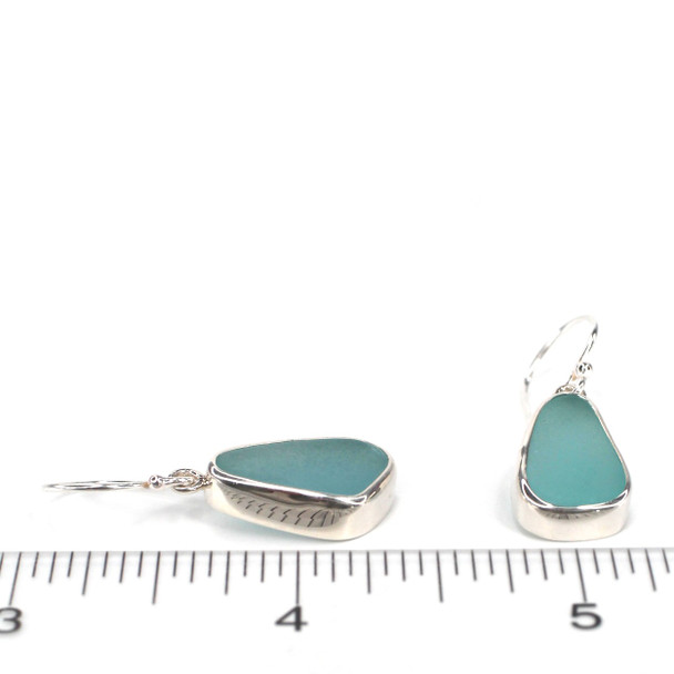 Aqua Ice Elongated Sea Glass Single Bezel Earrings on ruler for size reference.