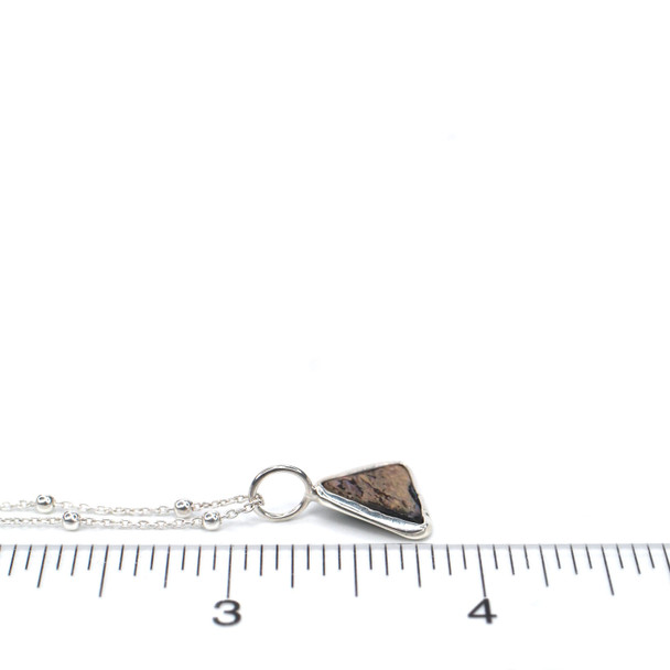 Abalone Triangle Charm on ruler for size reference.