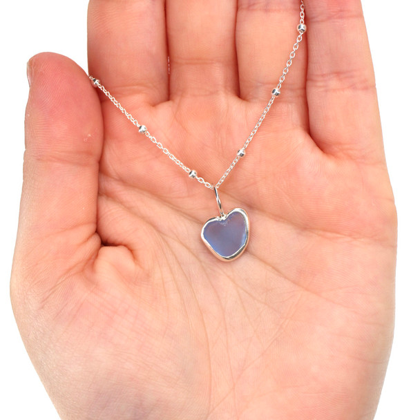Cornflower Plush Sea Glass Bezel Wrap Charm on model for color reference.