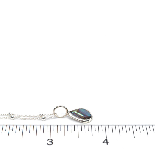 Abalone Teardrop Charm on ruler for size reference.