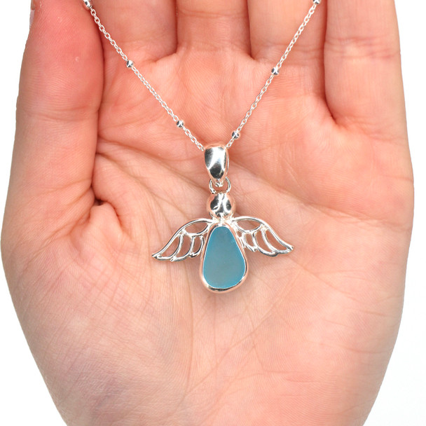 Turquoise Sea Glass Angel Necklace on model for color reference.