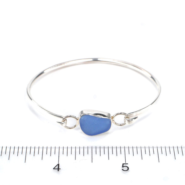 Cornflower Sea Glass Hinge Bangle Bracelet on ruler for size reference. 