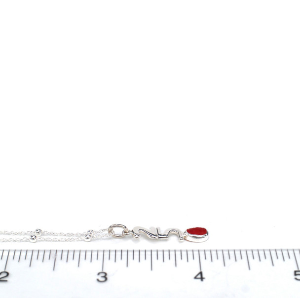 Red-Orange Sea Glass 250 Years Charm Necklace on ruler for size reference.