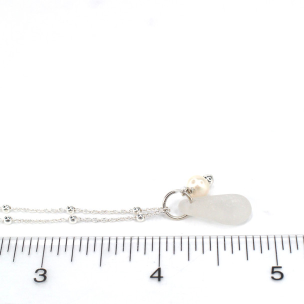 White Smooth Oval Sea Glass and Pearl Charm Pendant on ruler for size reference. 