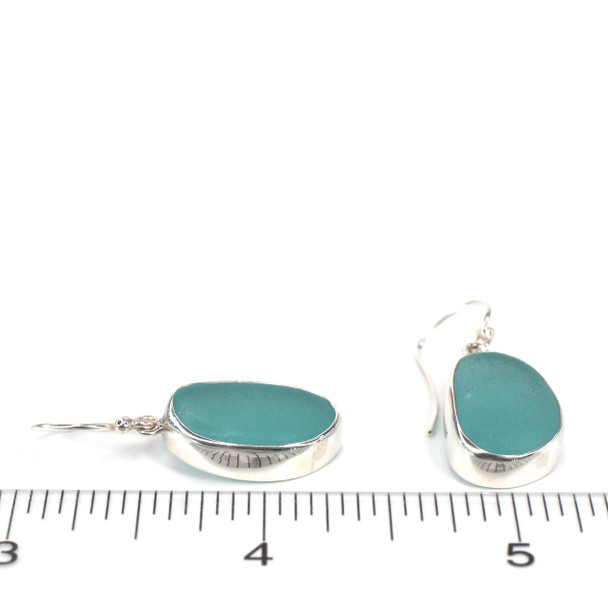 Aqua Oval Sea Glass Single Bezel Earrings on ruler for size reference.