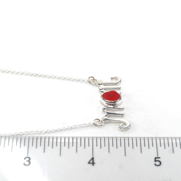 Red Orange Sea Glass Mom Necklace on ruler for size reference.