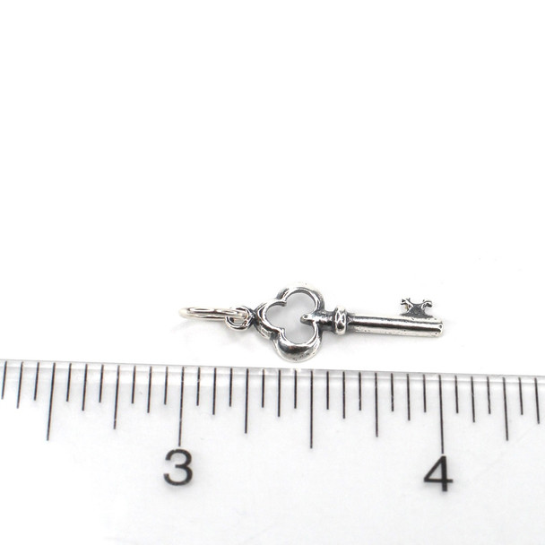 Sterling Silver Key Charm on ruler for size reference. 