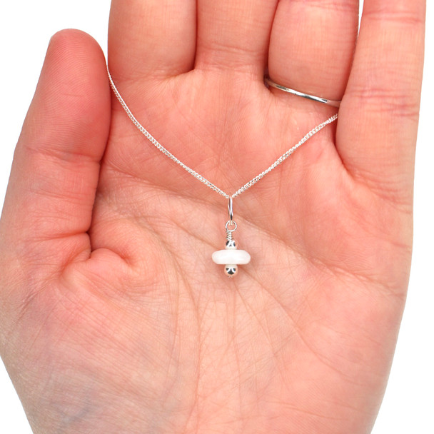 Blue Peruvian Opal Charm on model for color reference. 