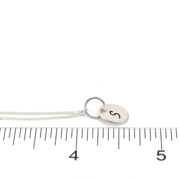 Sterling Silver Initial Charm on ruler for size reference. 