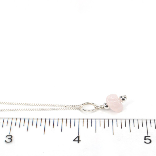 Rose Quartz Gemstone Charm on ruler for size reference. 