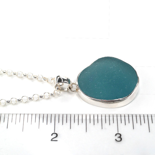 Aqua Rounded Sea Glass Single Bezel Necklace on ruler for size reference. 
