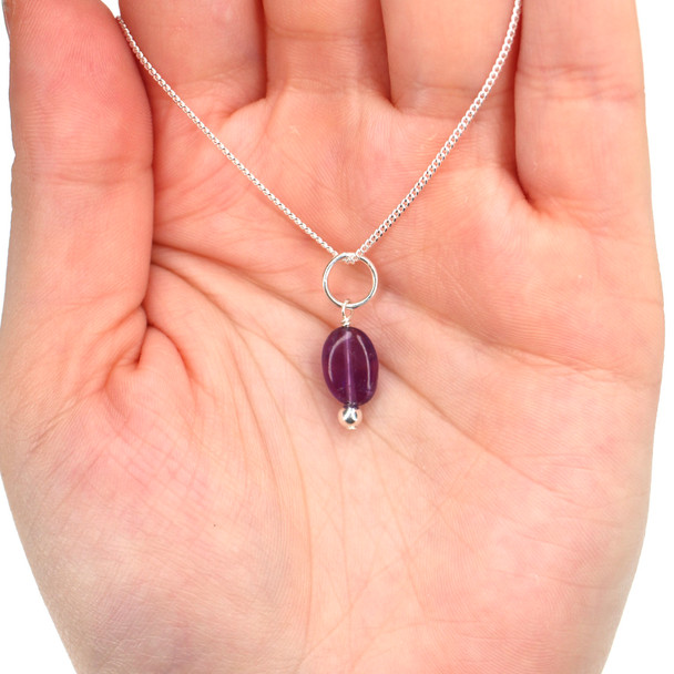 Amethyst Gemstone Charm on model for color reference. 